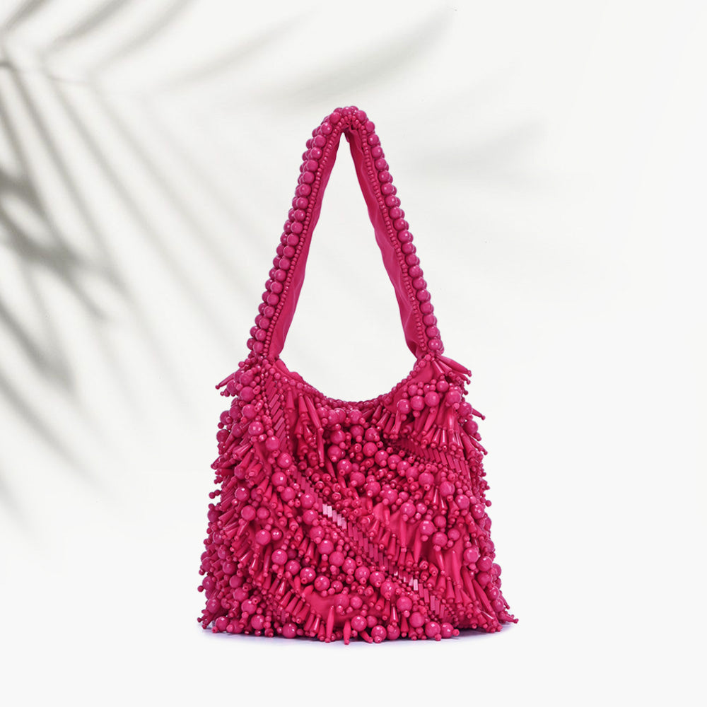 The Averlee Artisan Beaded Mini Bucket Bag in Fuchsia