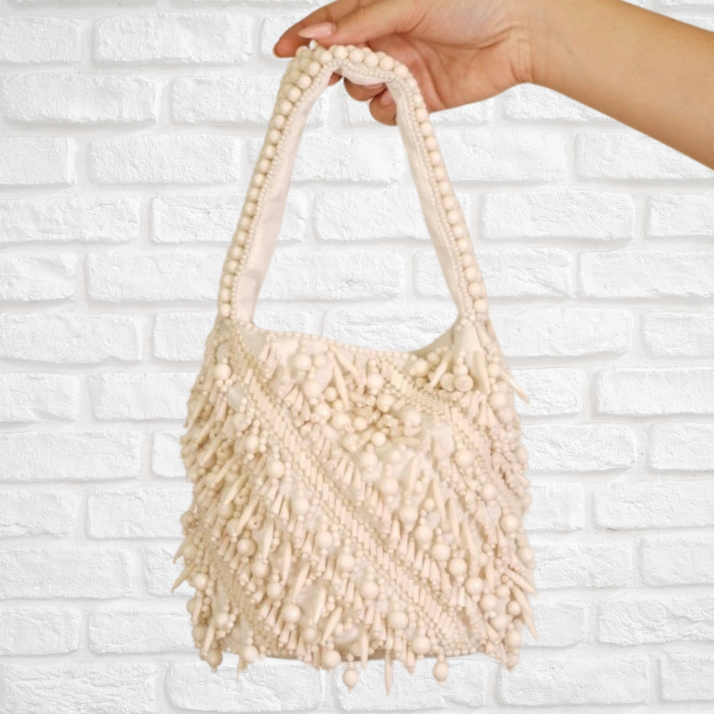 The Averlee Artisan Beaded Mini Bucket Bag in Cream