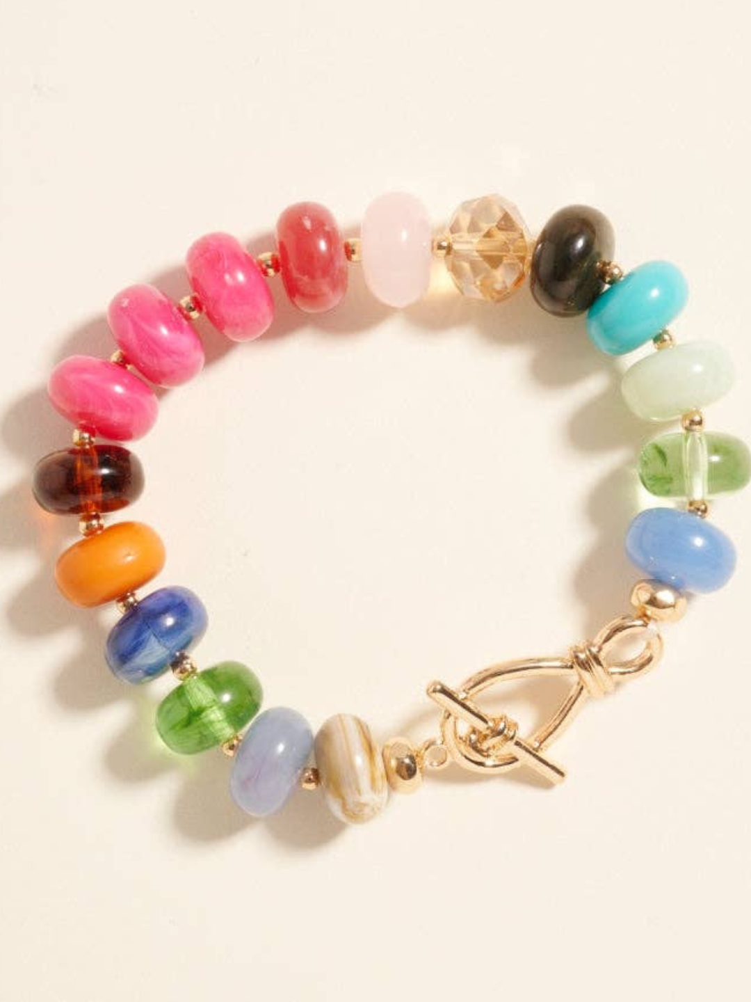 Pulsera elástica de cuentas ovaladas de resina marmoleada con efecto degradado